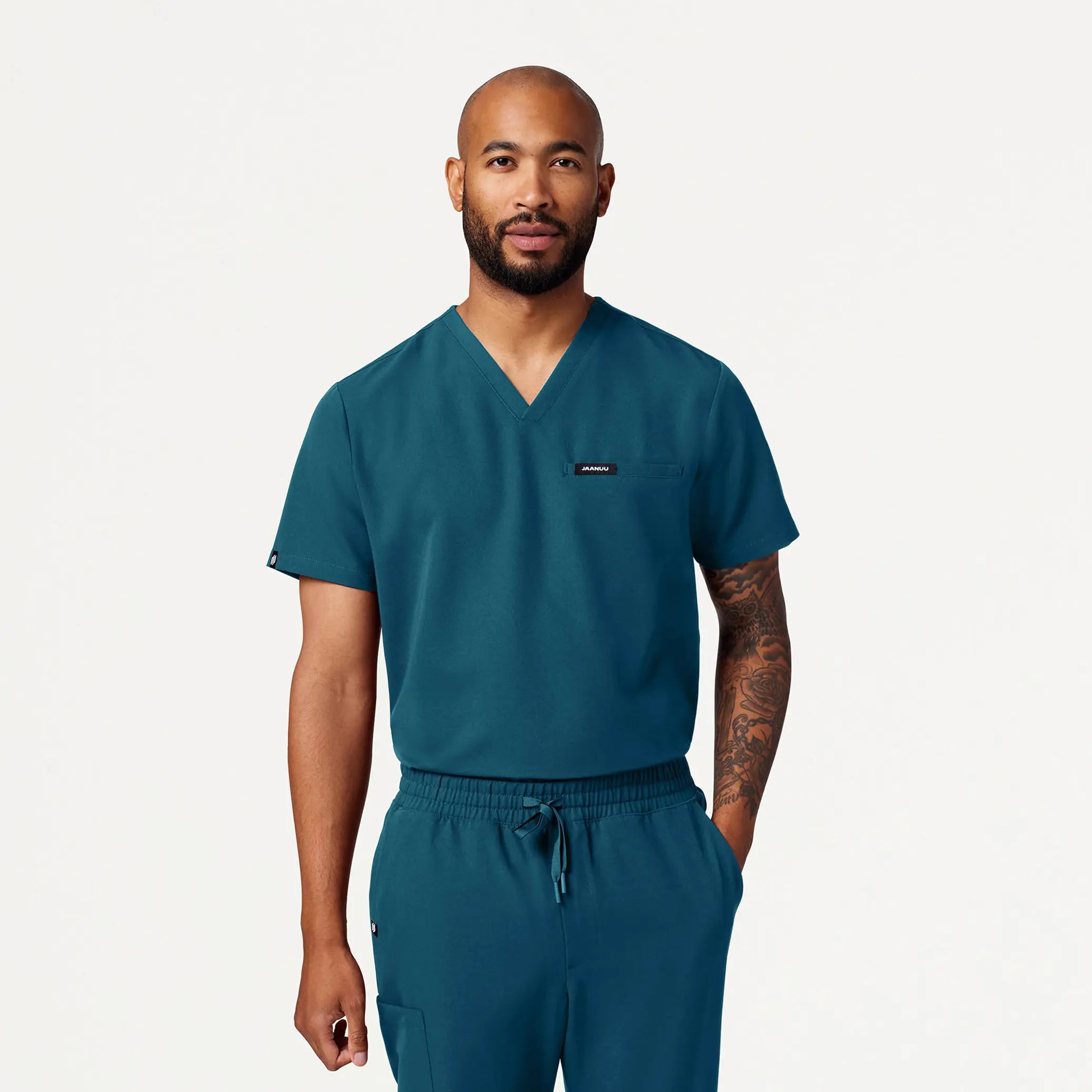 Make Your Weekend Count with Savings Jaanuu Men's Romin 1-Pocket Scrub Top - Caribbean Blue Make Your Weekend Count with Savings Jaanuu Men's Romin 1-Pocket Scrub Top - Caribbean Blue